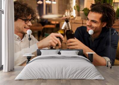 happy male friends drinking beer at bar or pub Wall mural