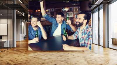 happy male friends drinking beer at bar or pub Wall mural