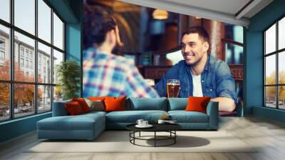 happy male friends drinking beer at bar or pub Wall mural