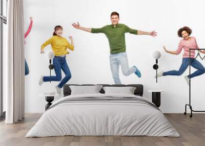 happy people or friends jumping in air over white Wall mural