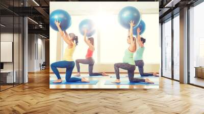 happy pregnant women exercising with ball in gym Wall mural