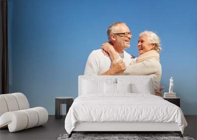 happy senior couple hugging outdoors Wall mural