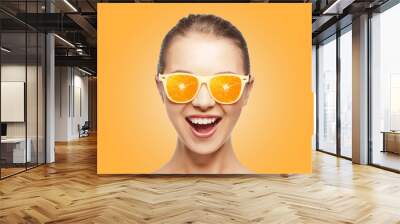 happy teenage girl in sunglasses with oranges Wall mural