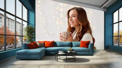 happy woman with cup of tea or coffee at home Wall mural