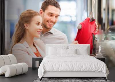 happy young couple choosing dress in mall Wall mural