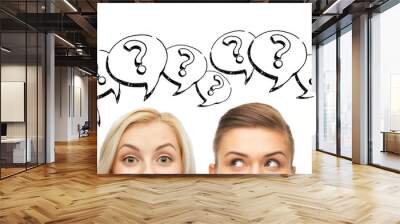 happy young women faces with question marks Wall mural