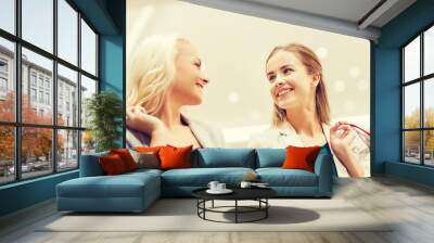 happy young women with shopping bags in mall Wall mural