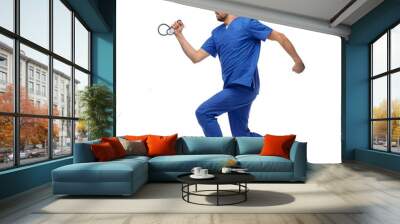 healthcare, profession and medicine concept - doctor or male nurse in blue uniform with stethoscope jumping in air over white background Wall mural