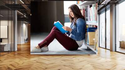 high school student girl reading book at library Wall mural