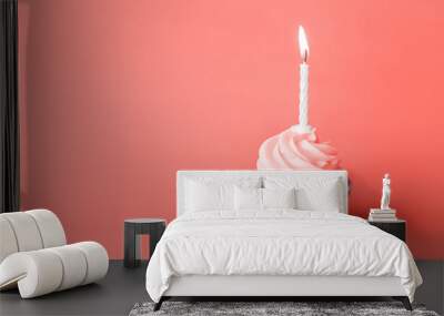 holiday, celebration, greeting and party concept - birthday cupcake with one burning candle in trendy color of the year 2019 living coral Wall mural