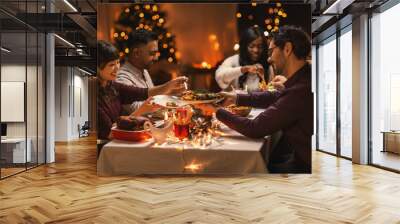 holidays, party and celebration concept - multiethnic group of happy friends having christmas dinner at home Wall mural