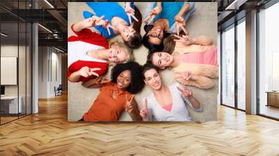 international group of happy women showing peace Wall mural