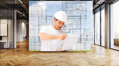 male architect looking at blueprint Wall mural