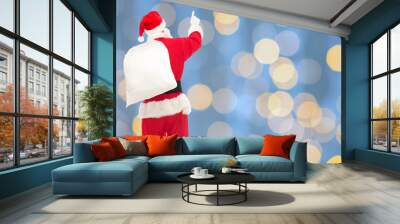 man in costume of santa claus with bag Wall mural