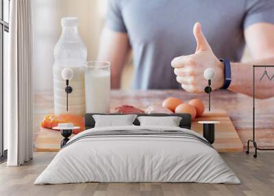 man with food  rich in protein showing thumbs up Wall mural