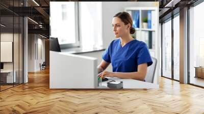 medicine, technology and healthcare concept - female doctor or nurse with computer working at hospital Wall mural