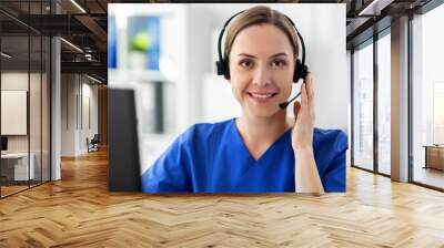 medicine, technology and healthcare concept - happy smiling female doctor or nurse with headset and computer working at hospital Wall mural