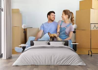 mortgage, people and real estate concept - happy couple with boxes and french bulldog dog moving to new home Wall mural