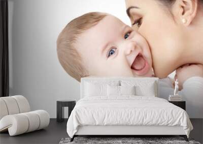 mother kissing adorable baby Wall mural