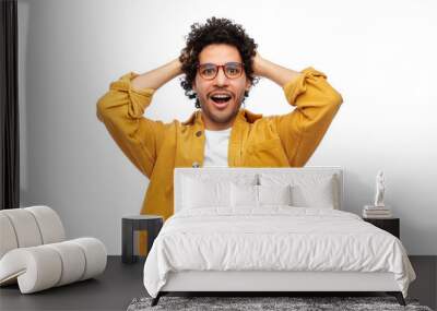 people, emotion and expression concept - happy smiling man in glasses and yellow jacket holding to his head over white background Wall mural