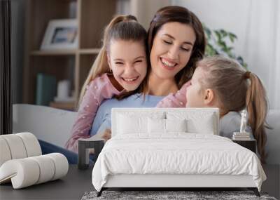 people, family and love concept - happy smiling mother with two daughters at home Wall mural