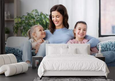 people, family and love concept - happy smiling mother with two daughters at home Wall mural