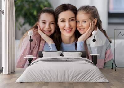 people, family and love concept - happy smiling mother with two daughters at home Wall mural