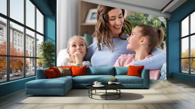 people, family and love concept - happy smiling mother with two daughters at home Wall mural