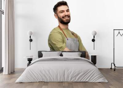 people, profession and job concept - happy smiling barman in apron with crossed arms over white background Wall mural