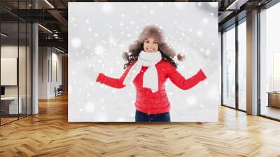 people, season and leisure concept - happy smiling woman in winter fur hat outdoors Wall mural