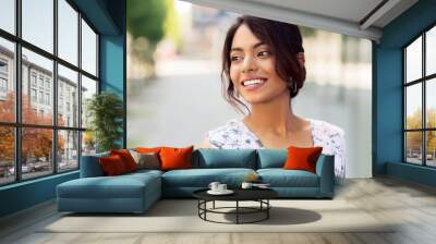 people concept - portrait of happy smiling indian woman outdoors Wall mural