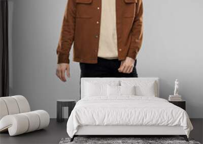 people concept - young man in brown jacket and black pants with mustaches over grey background Wall mural