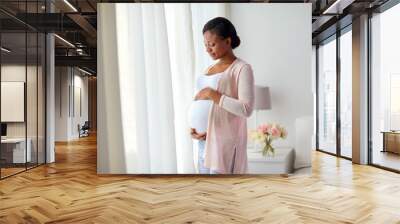 pregnant african american woman at home window Wall mural