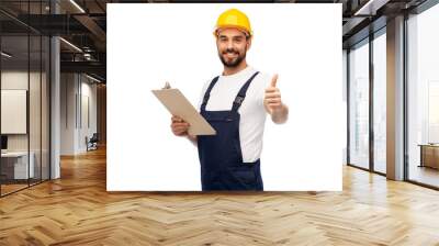 profession, construction and building - happy smiling male worker or builder in helmet with clipboard showing thumbs up over white background Wall mural