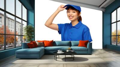 profession, job and people concept - happy smiling delivery woman in blue uniform over white background Wall mural