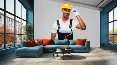 repair, construction and building - happy smiling indian builder or painter in helmet with paint roller over grey background Wall mural