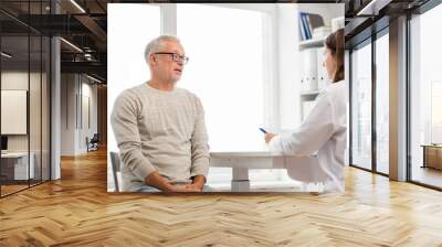 senior man and doctor meeting at hospital Wall mural