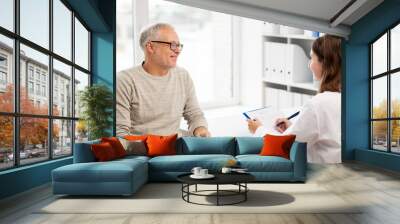 senior man and doctor meeting at hospital Wall mural