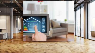 smart home and technology concept - close up of male hands pointing finger to tablet pc computer with house settings on screen over living room background Wall mural