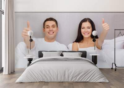 smiling couple in bed with tablet pc computers Wall mural