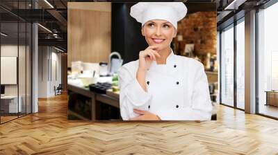 smiling female chef dreaming Wall mural