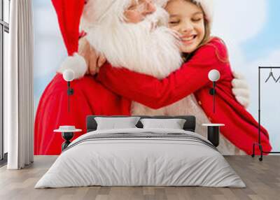 smiling little girl with santa claus Wall mural