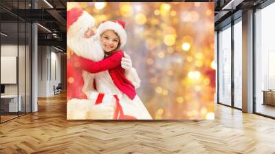 smiling little girl with santa claus Wall mural