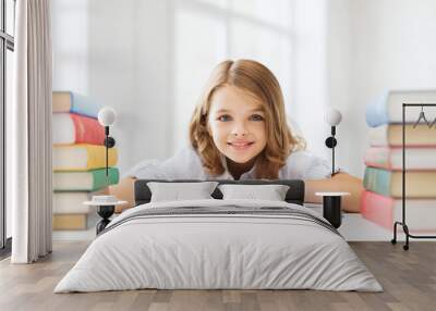 smiling little student girl with many books Wall mural