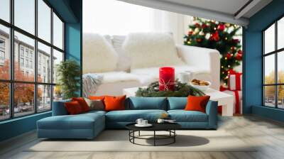 sofa, table and christmas tree with gifts at home Wall mural