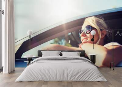 summer vacation, holidays, travel, road trip and people concept - happy smiling teenage girl or young woman in car Wall mural