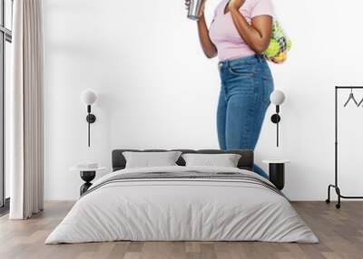 sustainability and people concept - smiling young african american woman with thermo cup for hot drinks and food in string bag walking over white background Wall mural