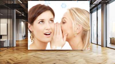 two happy young girlfriends with twinkles and snowflakes Wall mural