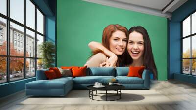 two laughing girls hugging Wall mural