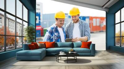 two smiling builders in hardhats with tablet pc Wall mural